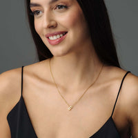 Thumbnail for Woman wearing Iconic Initial Necklace by Brother & Sisters featuring a polished gold initial pendant.