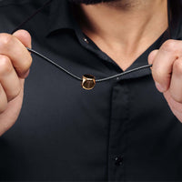 Thumbnail for Gold Cube Initial Necklace worn by a man, showcasing the bold and minimalistic design from Brother & Sisters.