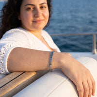 Thumbnail for Be Gorgeous, Be Yourself bracelet in silver worn during a relaxed moment | SKU: bgby-wg