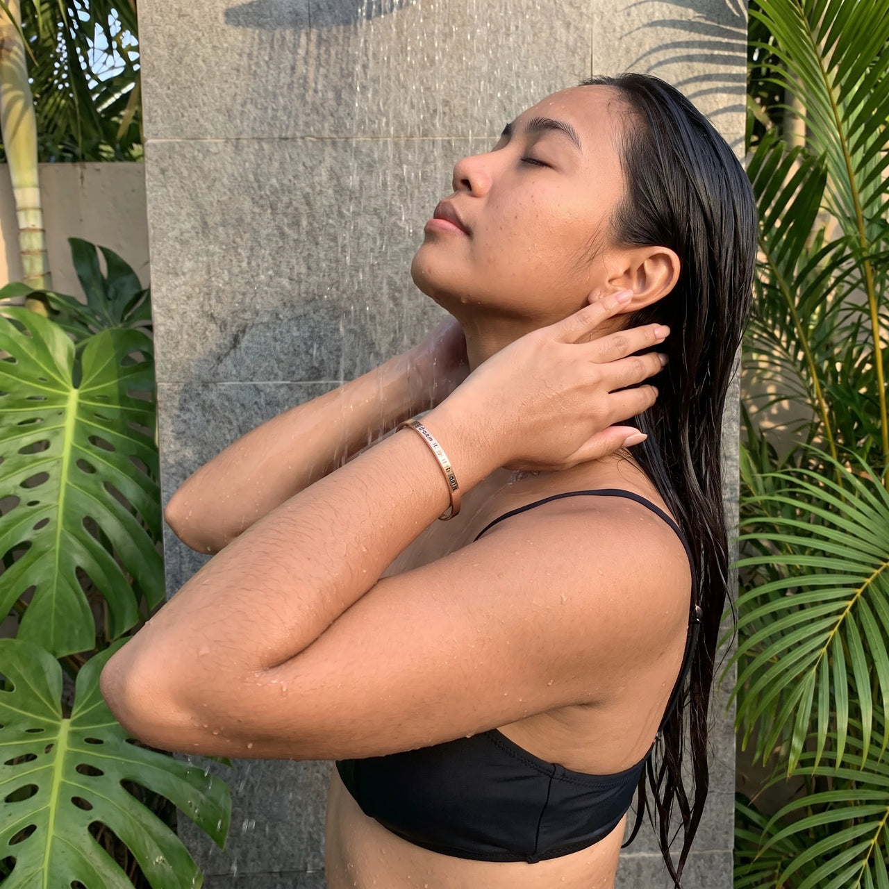 Rose gold engraved cuff bracelet worn in a tropical outdoor shower | SKU: 4214557-imitation-rhodium-plated