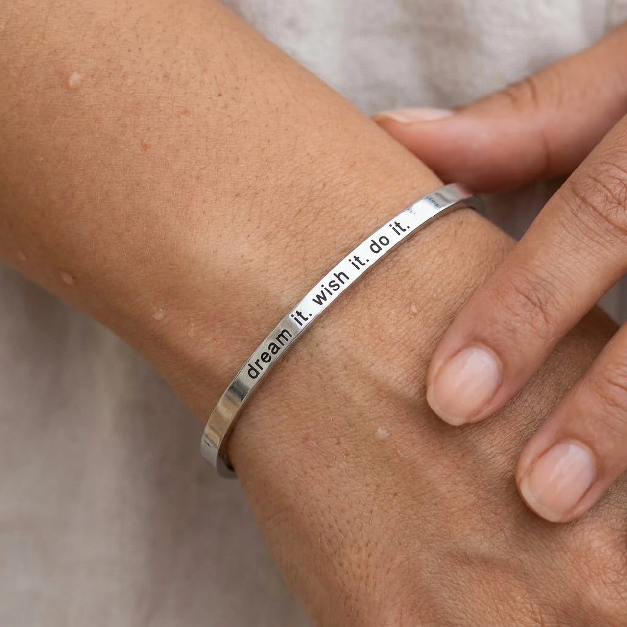 Close-up of the silver engraved cuff bracelet worn on the skin | SKU: 4214557-silver-plated