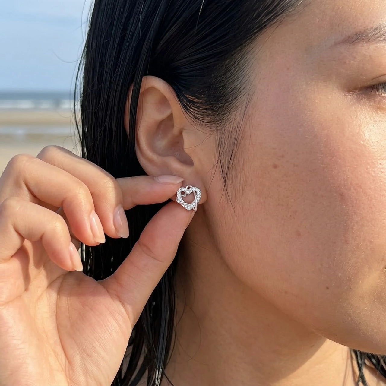 Silver stud earrings worn, showing its real size | SKU: 4478648-platinum-plated-clear