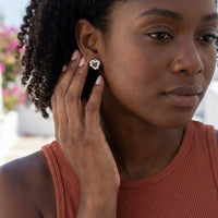 Thumbnail for Woman gently touching her silver stud earrings | SKU: 4478648-platinum-plated-clear
