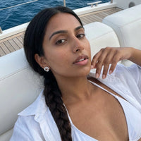Thumbnail for Woman on a yacht wearing the silver stud earrings | SKU: 4478648-platinum-plated-clear