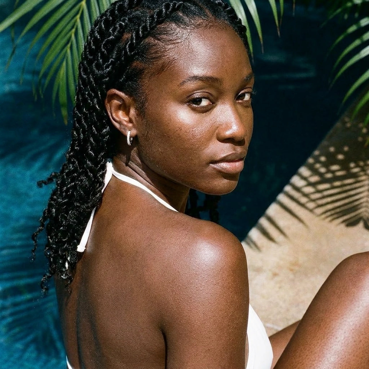 Pave Huggie Hoop Earrings in Silver, worn by a tropical pool | SKU: 41011-silver