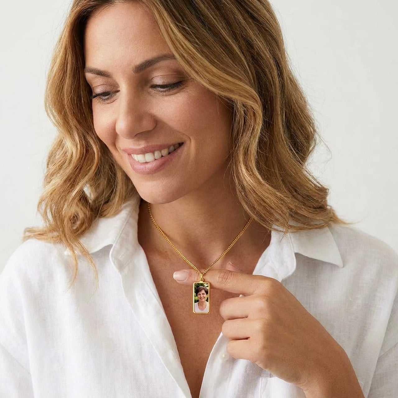 Woman wearing the gold bar photo necklace with her late mother's photo | SKU: TPH-BARN-GOLD